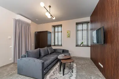 a living room with a couch and a table at MnW apartment by Polo Apartments in Kaunas