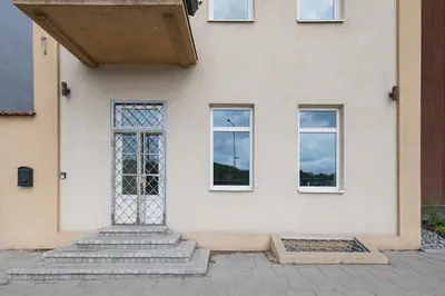 a house with a door and three windows at MnW apartment by Polo Apartments in Kaunas