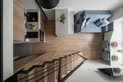 a staircase in a room with wooden walls and ceilings at Loft 13 in Vilnius
