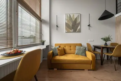 a living room with a couch and a table at Loft 14 in Vilnius