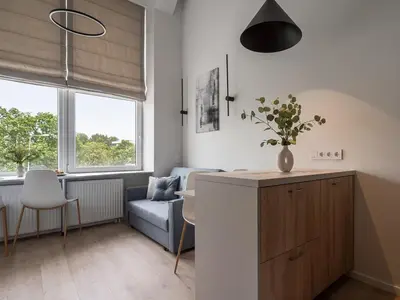 a living room with a couch and a table at Loft 12 in Vilnius