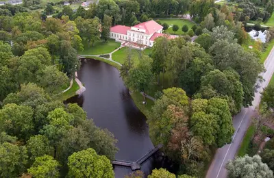 an aerial view of a house and a river at Taujėnų dvaro rūmai in Towiany