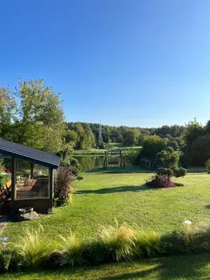 a garden with a pavilion and a playground at Namelis prie Čiobiškio kelto