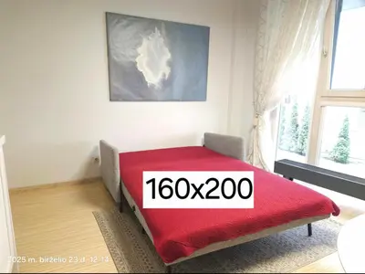 a room with a bed with a red blanket at Happy Inn Sweet Old Town Studio, Self check in, Parking in Vilnius