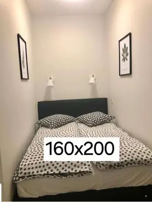 a bedroom with a bed with a sign on it at Happy Inn Sweet Old Town Studio, Self check in, Parking in Vilnius
