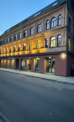 a large brick building on the side of a street at Rambynas R36 in Panevėžys