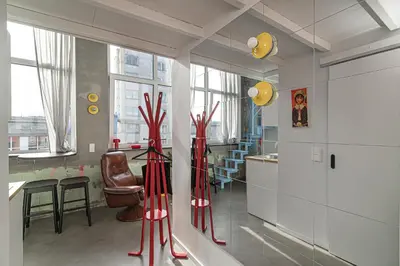 a room with red vases in the middle of a kitchen at Brand-new & Stylish Loft - Hip District Uptown by Reside Baltic in Vilnius