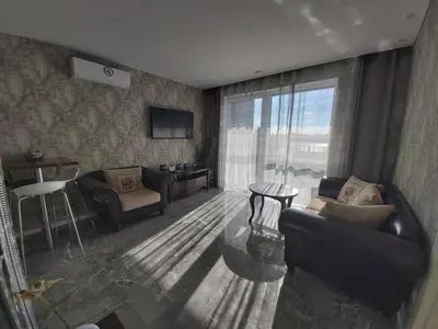 a living room with a couch and a table at Light House in Vilnius