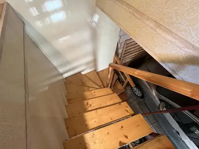 an overhead view of a wooden staircase in a room at Sodyba prie Ąžuolo