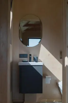 a bathroom with a sink and a mirror at MyRetreat - cabin for two