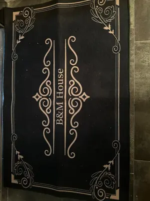 a blackboard with a gold design on it at B&M Jacuzzi Rezidencija SELF CHECK - IN in Vilnius