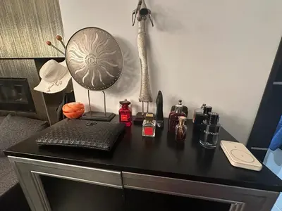 a desk with a laptop and a lamp on it at B&M Jacuzzi Rezidencija SELF CHECK - IN in Vilnius