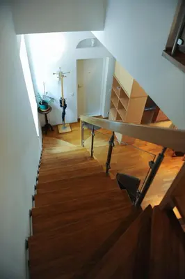 a stairway with a cross on the wall and a cross on the floor at Best Location 3 Bedroom Apartment in Vilnius
