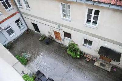 an overhead view of a building with a courtyard at Rooftop Charm Stylish 2BDR Steps from Town Hall in Vilnius