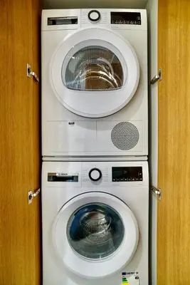 a washing machine and a dryer in a room at Flat in Vlinius city center in Vilnius
