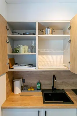a kitchen with a sink and a counter top at Green Apartment with free parking in Kaunas