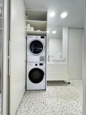 a laundry room with a washer and dryer at Bright white in Vilnius