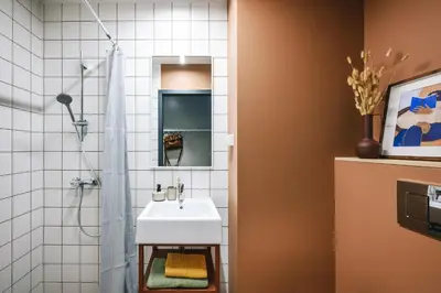 a bathroom with a sink and a shower at Liv in Vilnius New town in Vilnius