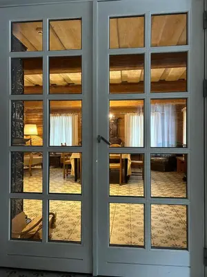 an open door with a view of a dining room at Rustic Guesthouse in Pine Forest