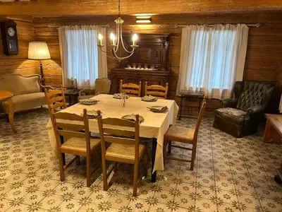 a dining room with a table and chairs at Rustic Guesthouse in Pine Forest