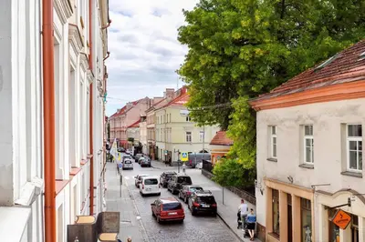 a view of a city street with cars parked at Old Town T8 SELF Check In in Vilnius