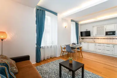 a living room with a couch and a table at Old Town T8 SELF Check In in Vilnius