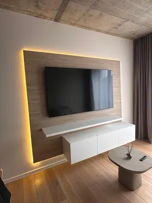 a living room with a television on a wall at Apartamentai prie Soboro in Kaunas