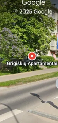 a sign on the side of a road at Apartamentai Grigiškes in Grigiškės