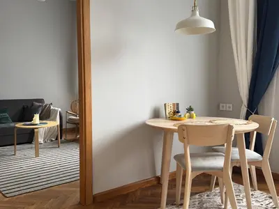 a dining room with a table and chairs at Maironio g Centras in Kaunas