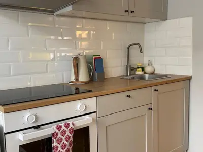 a kitchen with a sink and a counter top at Maironio g Centras in Kaunas