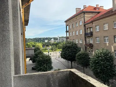 a view from a window of a street with trees at Maironio g Centras in Kaunas
