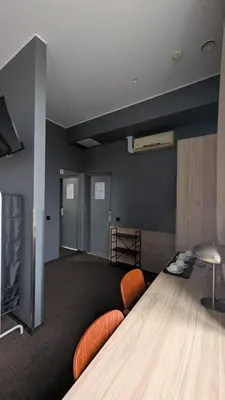 a large room with a couch and a table at Stylish Private Room in Art Hotel Central Vilnius in Vilnius