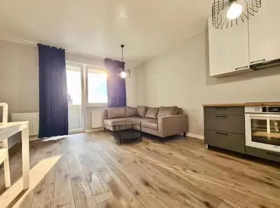 a living room with a couch and a table at Krivių Street Residential in Vilnius