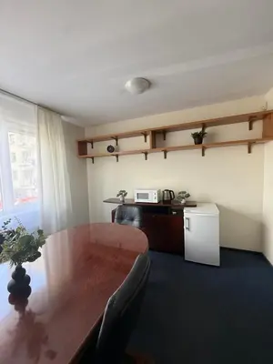 a room with a table and chairs and a desk at Seliu 29 in Vilnius