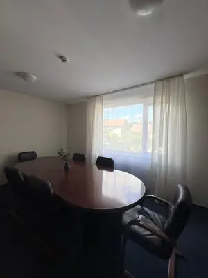 a room with a table and chairs and a window at Seliu 29 in Vilnius