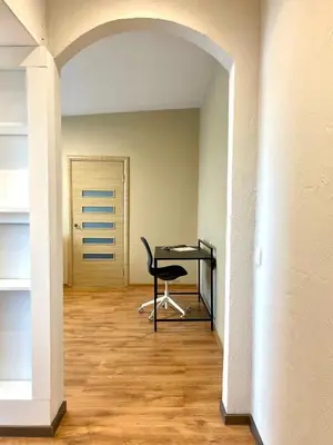 an empty room with a desk and a chair at Mens Cave in Šiauliai