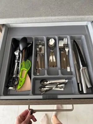 a tray filled with utensils in a drawer at Moonlight Apartment - Parko rezidencija SELF CHECK IN in Panevėžys