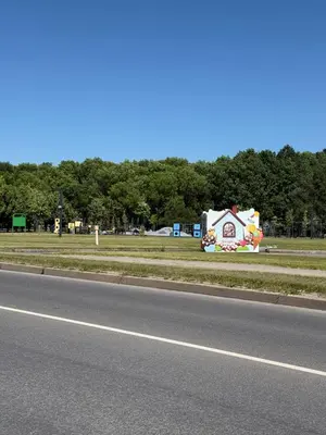 a small house on the side of a road at Moonlight Apartment - Parko rezidencija SELF CHECK IN in Panevėžys
