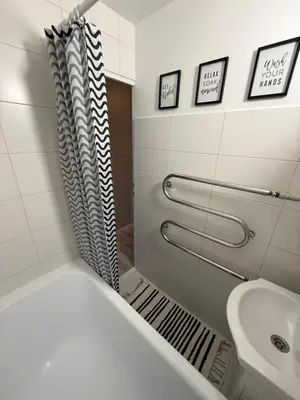 a bathroom with a shower and a sink at Studio apartment Morkus 2 in Šiauliai