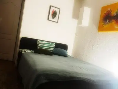 a bed with two pillows on it in a room at Studio 10 min walk from old town in Vilnius