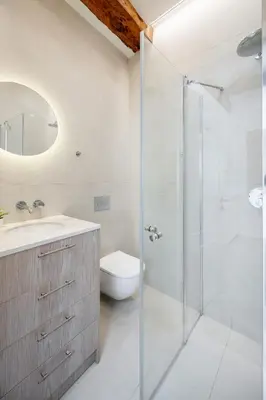 a bathroom with a shower and a toilet and a sink at Central Bright I Etmonu st I Easy Check in I Cᴏʜᴏsᴛ in Vilnius
