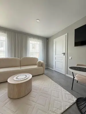 a living room with a couch and a coffee table at Relaxation Corner on Kranto in Kaunas