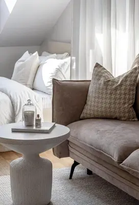 a living room with a couch and a coffee table at Traku apartament in Pakopi