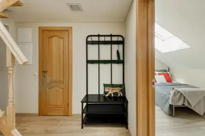 a bedroom with a bed and a black table at Old Town Apartment in Jonava