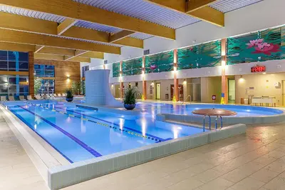 a large swimming pool in a large building at Medical SPA 