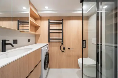 a bathroom with a toilet and a sink and a shower at Lovely new loft in Vilnius centre self-check in in Vilnius