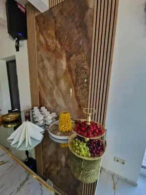 a buffet with three baskets of fruit on a table at Modern design in quiet nature