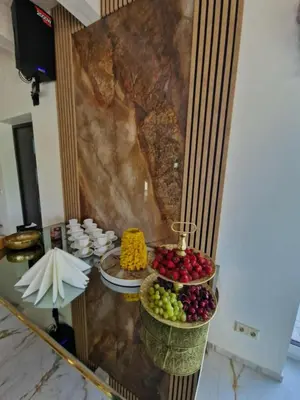 a buffet with plates of food on a table at Baltasis beržas