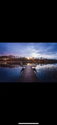 a picture of a dock in the middle of a lake at Čičirio krantas in Vėdariai