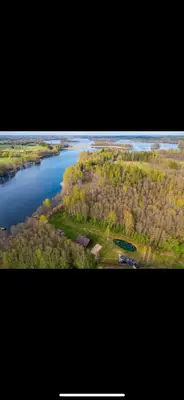 an aerial view of a river with trees and water at Čičirio krantas in Vėdariai